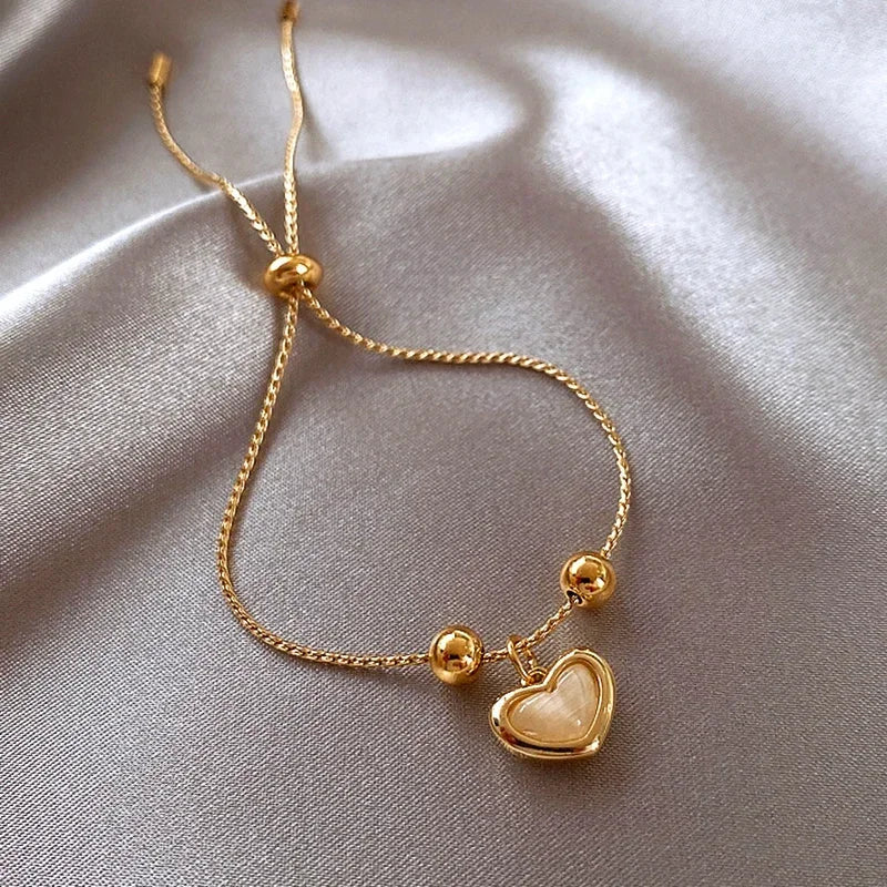 Heart-Shaped Bracelet of Peach Opal Coated with Gold