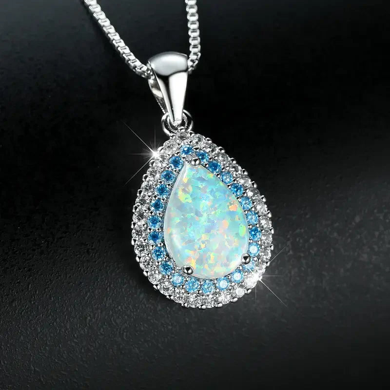 Elegant necklace with blue opal pendant and sparkling crystals | White gold