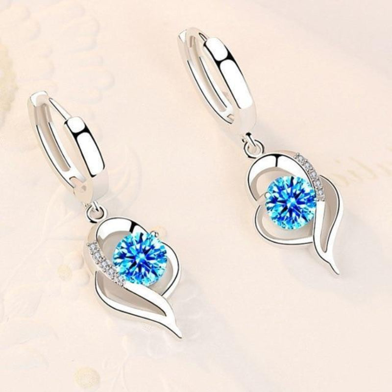 Silver earrings with inlaid zirconia flowers | White gold