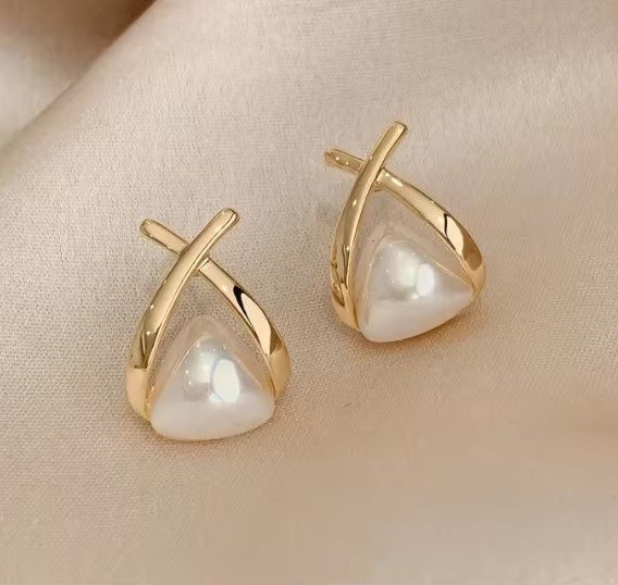 Vintage drop-shaped earrings with cross and triangle-shaped pearl
