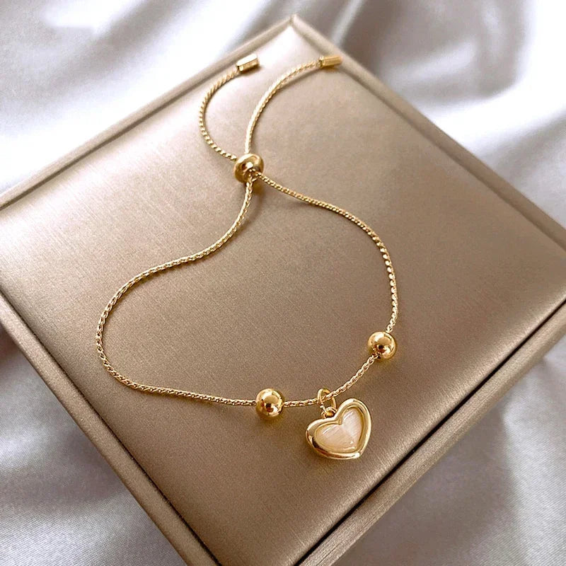 Heart-Shaped Bracelet of Peach Opal Coated with Gold